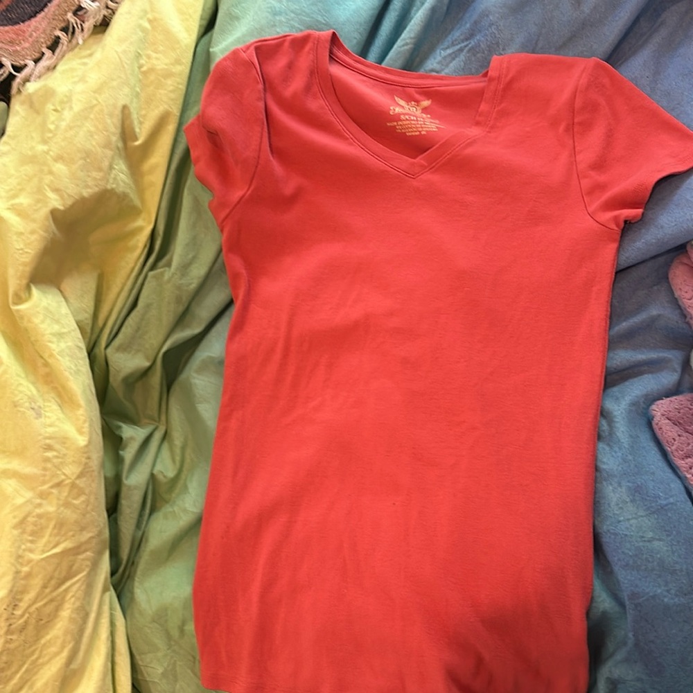 It is a pink shirt from Faded Glory, and it is a size small.